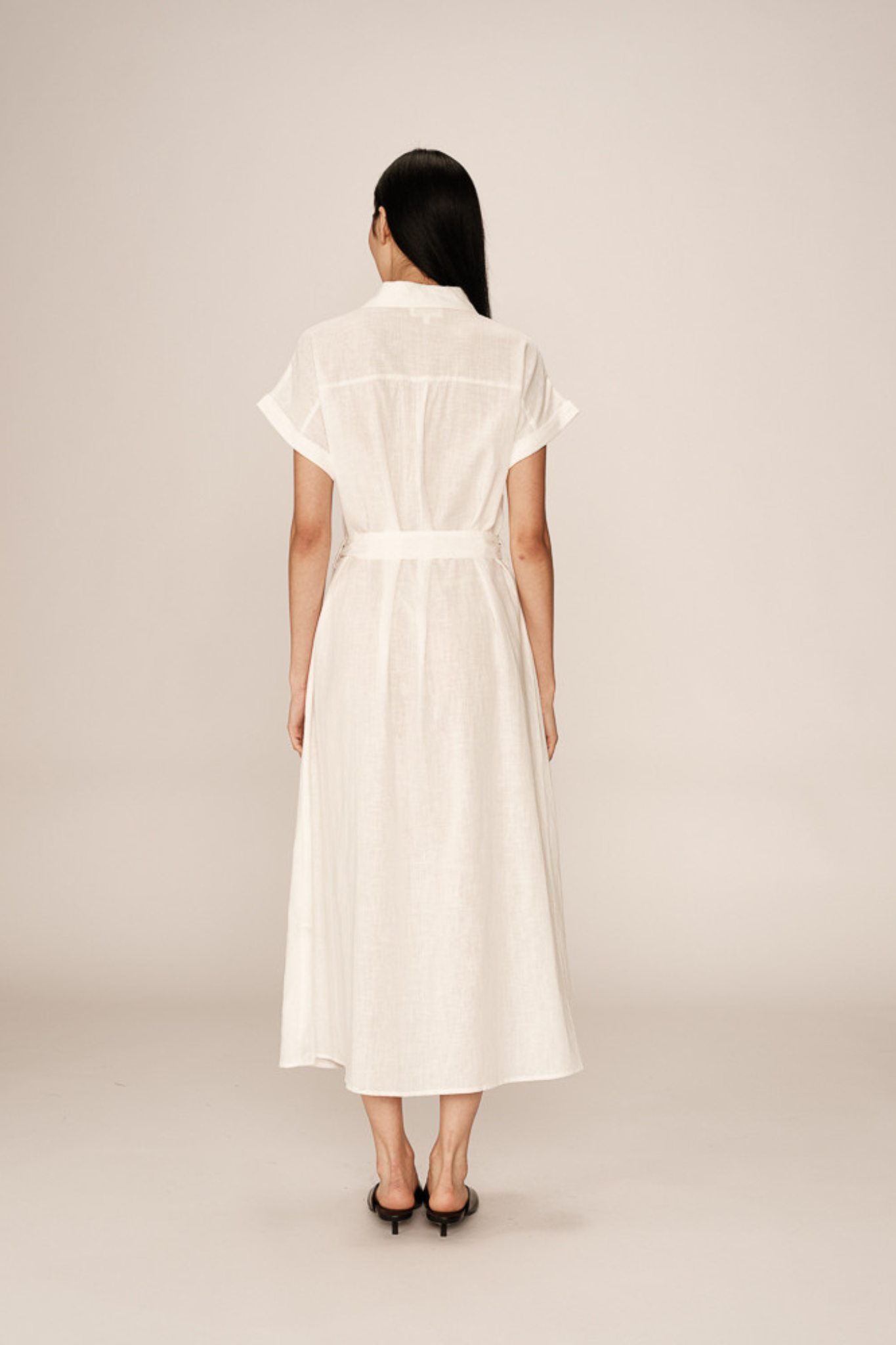 Model wearing the Grace & Milla prudence dress in white. Back view