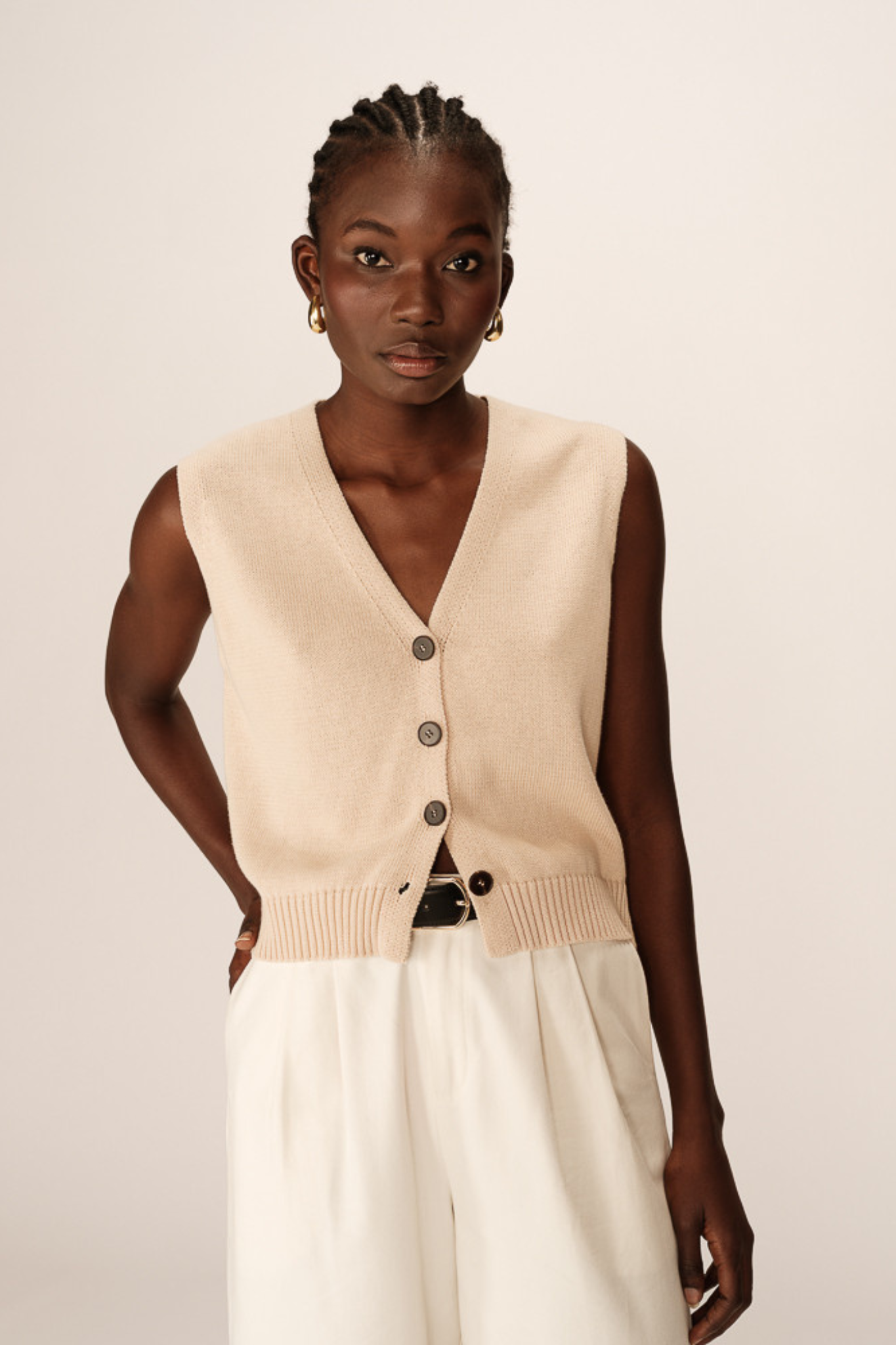 Model wearing the Grace & Mila pancake cardigan in ecru. Front view