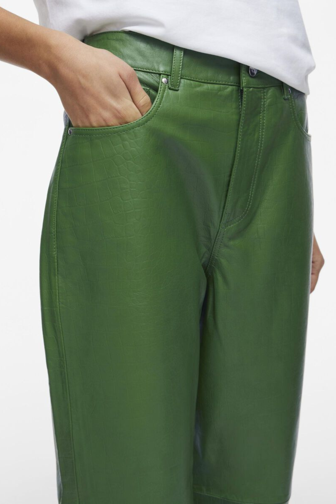 Model wearing the Rouge Edit artichoke green leather pants. Close front view