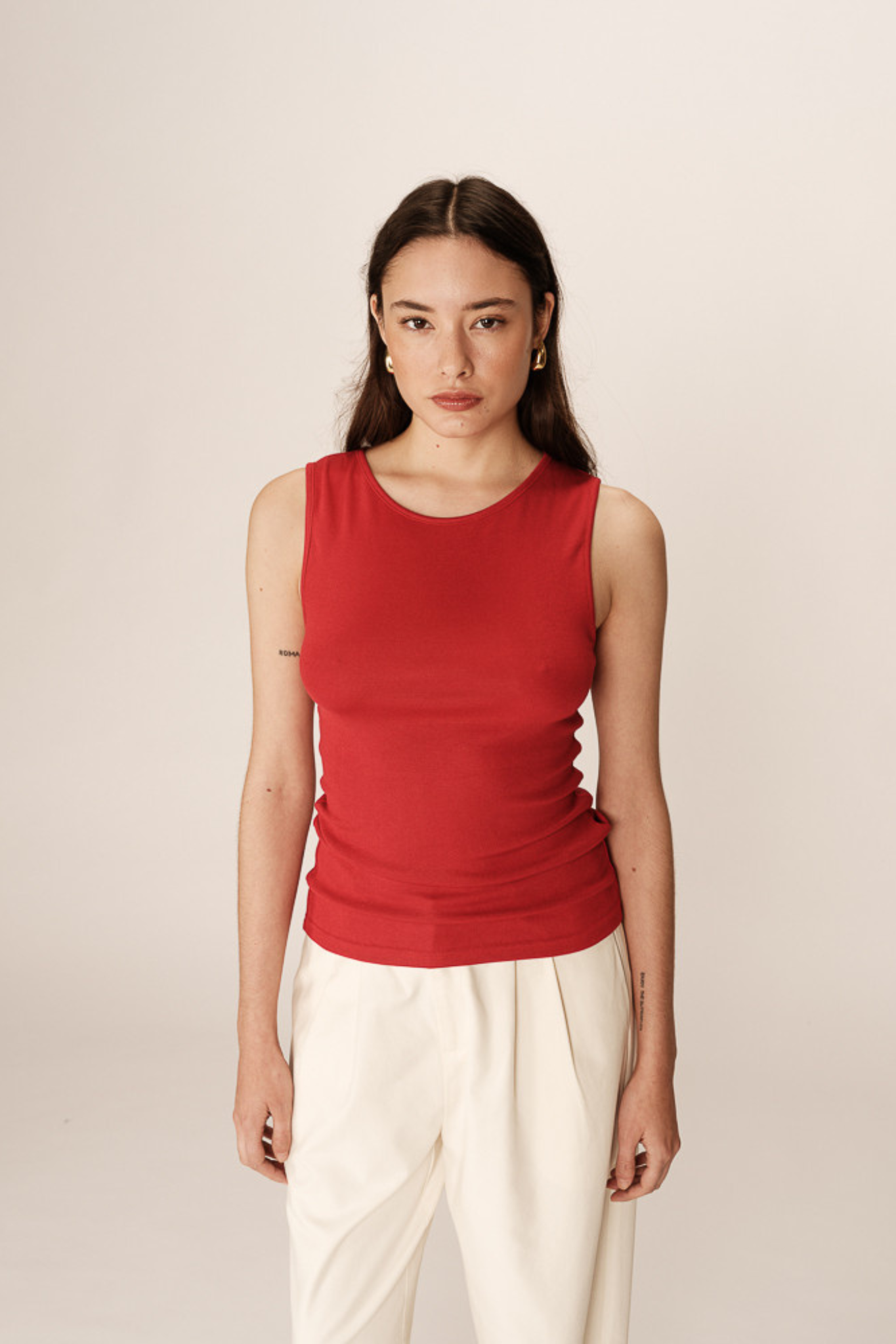 Model wearing the Grace & Mila paulin top in red. Front view