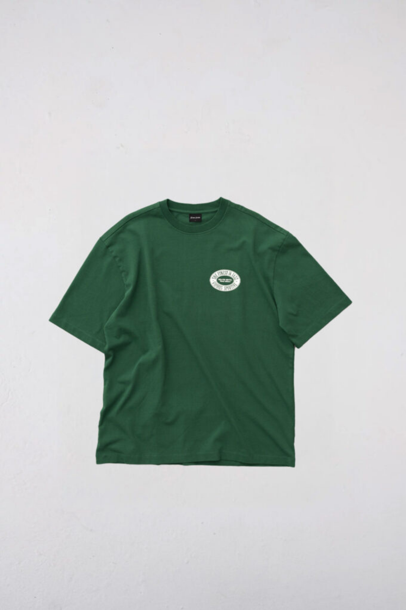 Goodies Sportive finest t-shirt in green and graphic in white. Front flatlay view