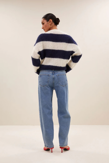 Model wearing the By-Bar Evi striped pullover in white and blue. Back view