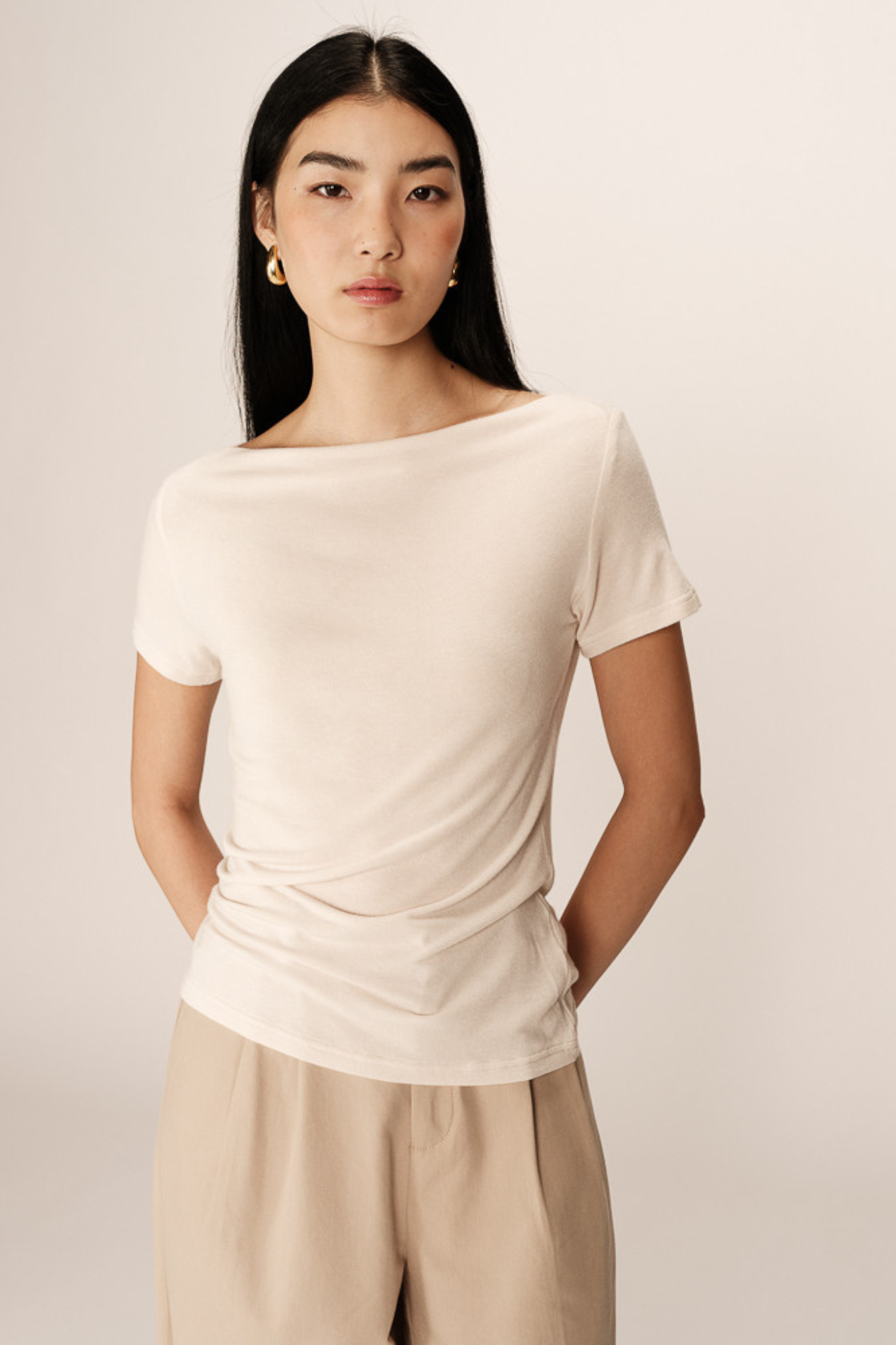 Model wearing the Grace & Mila pilar top in beige. Front view