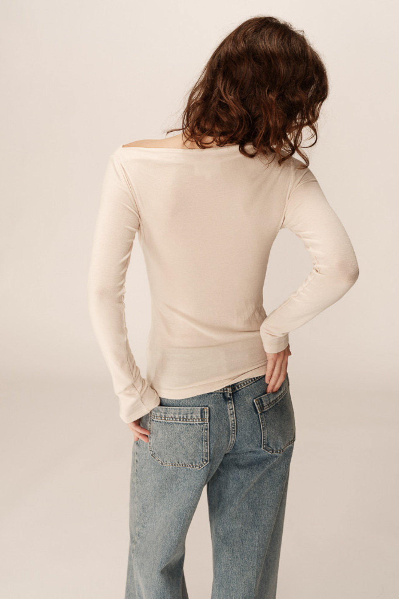 Model wearing the Grace & Mila ponti top in beige. Back view