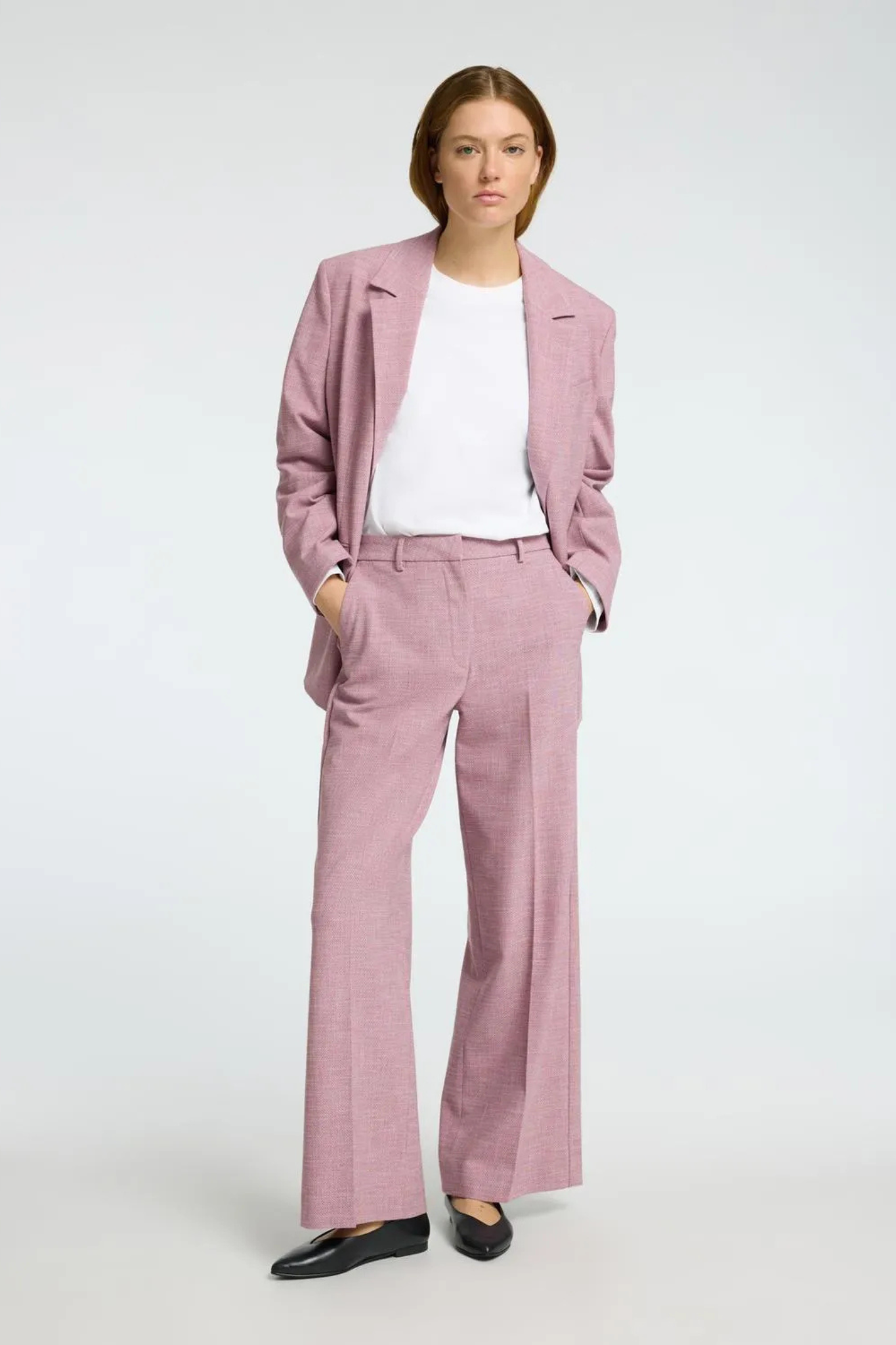 Model wearing the Selected Femme rae pants in bleached mauve/melange. Front view