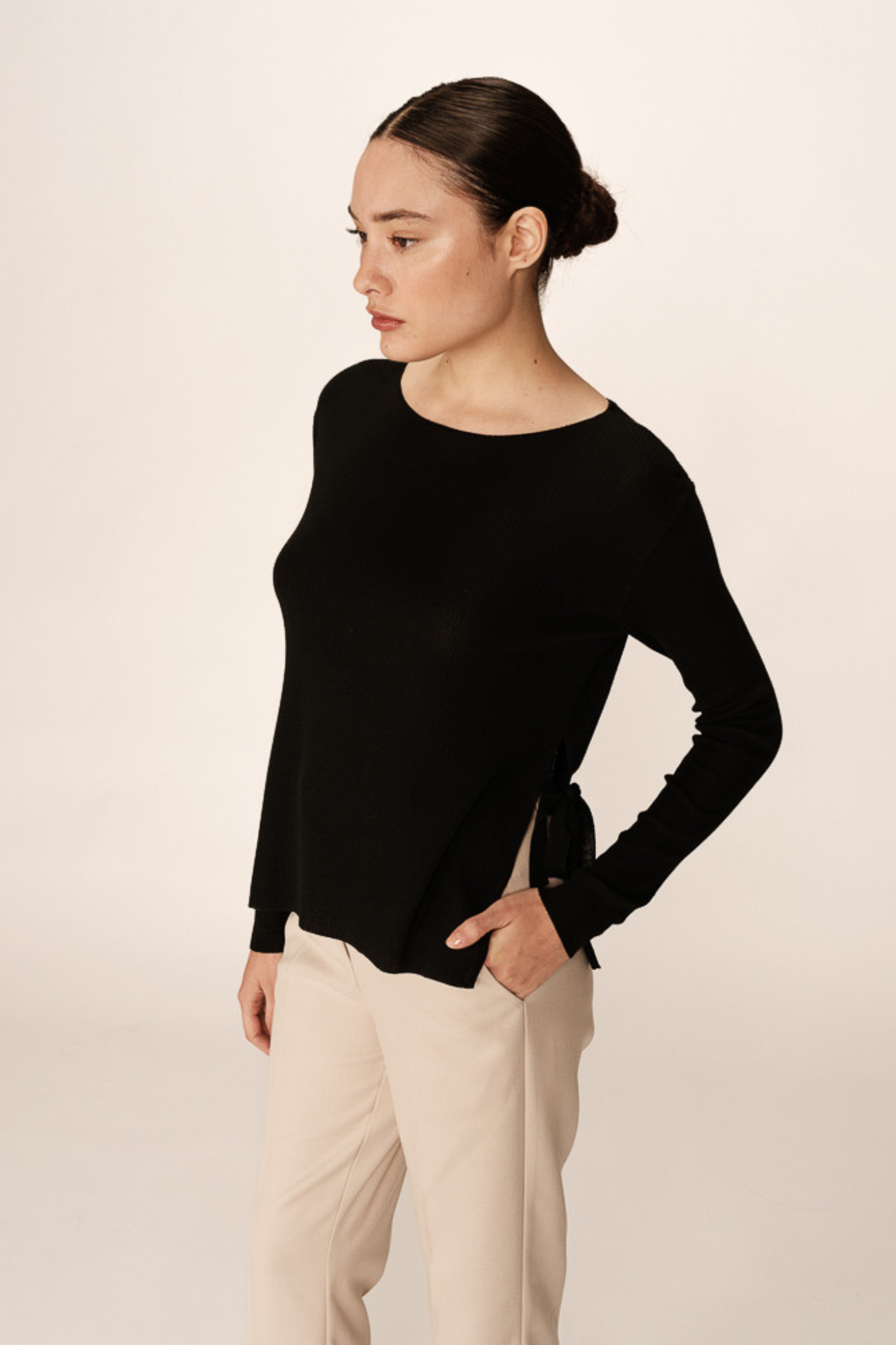 Model wearing the Grace & Mila palmer sweater in black. Front view