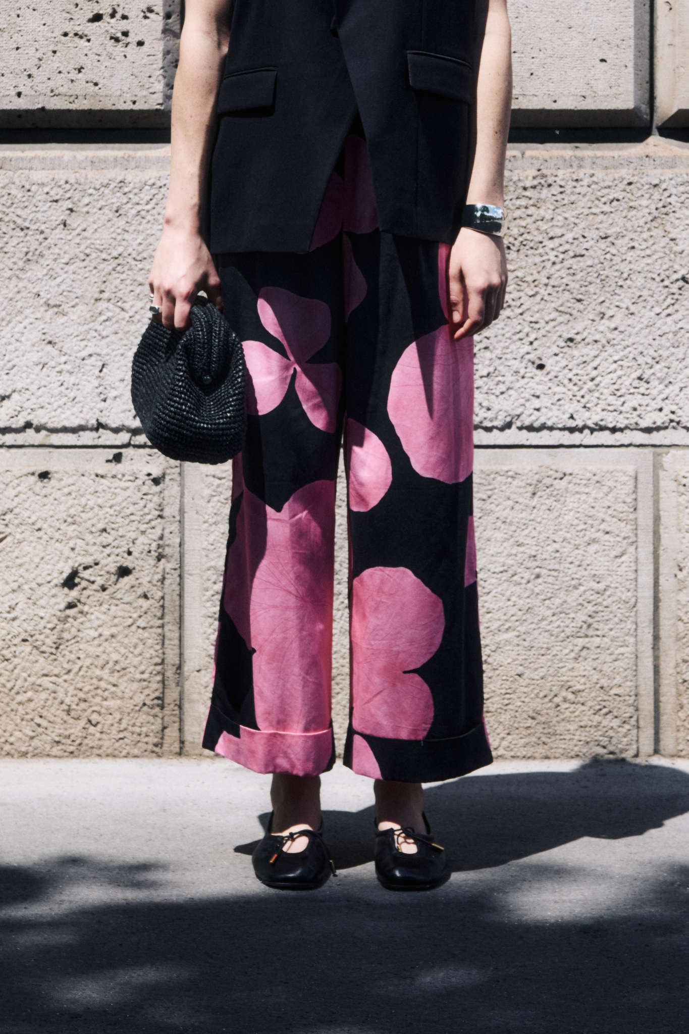 Model wearing the JIJI manon pants in maxi rose flower. Front view