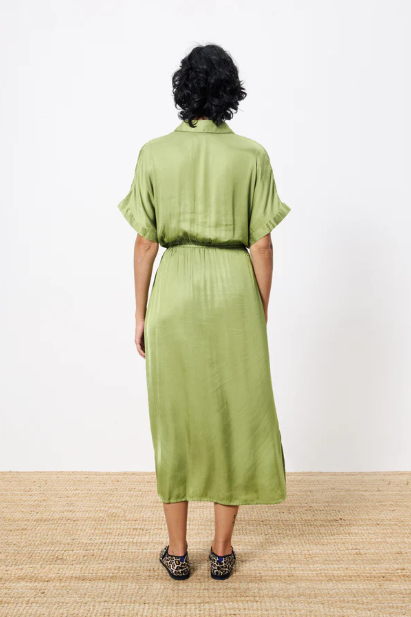 Model wearing the FRNCH estee dress in green. Back view