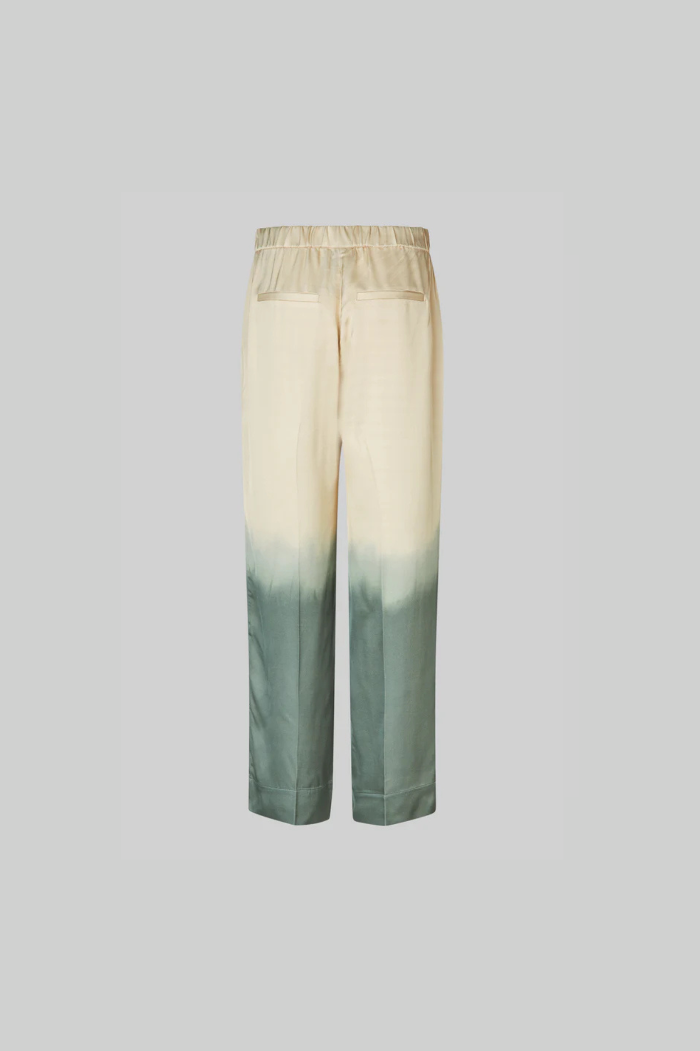 Second Female avora pants in beige and green. Back flatlay view