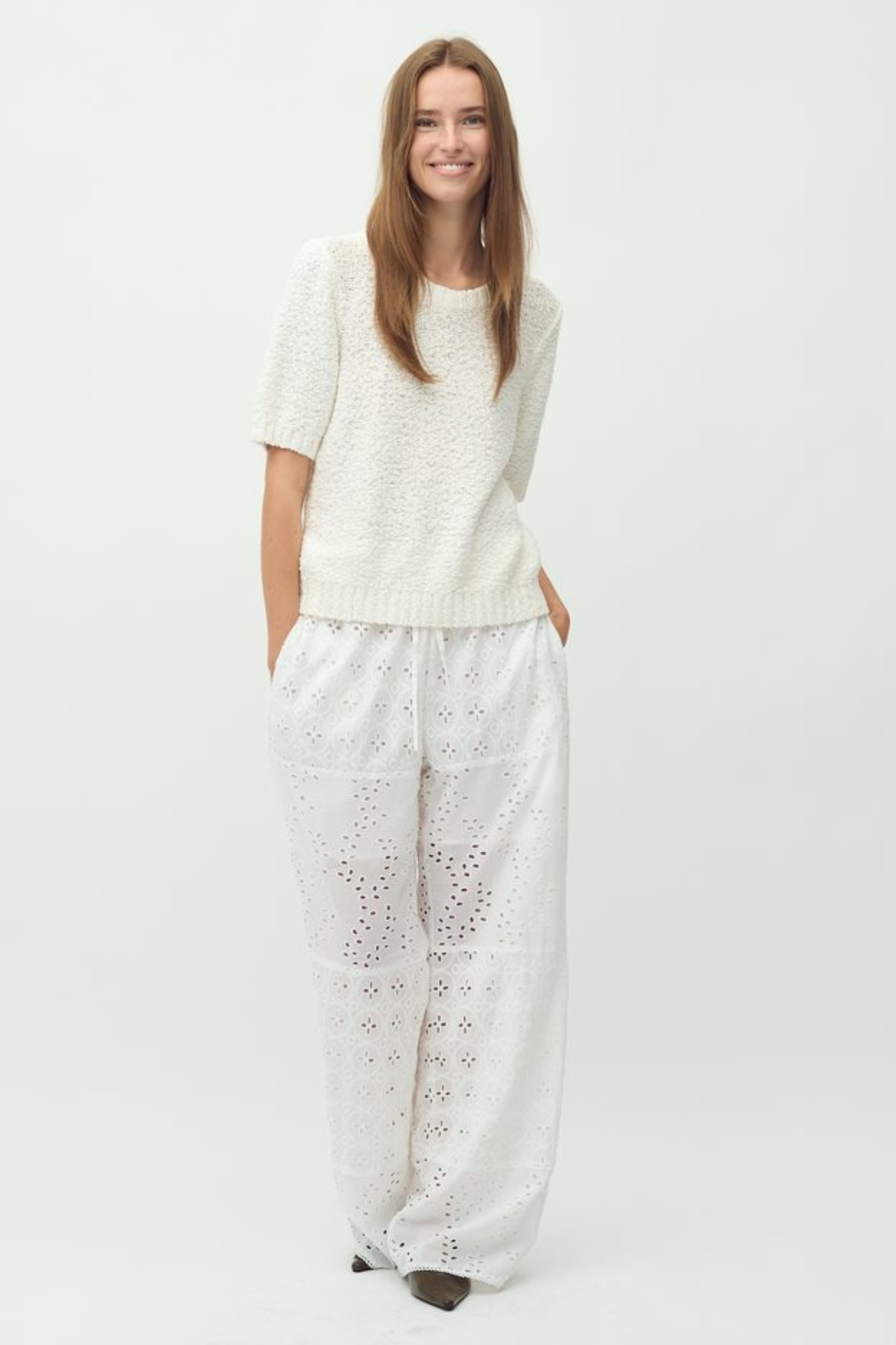 Model wearing the MBYM viljane embroidery pants in white. Front view