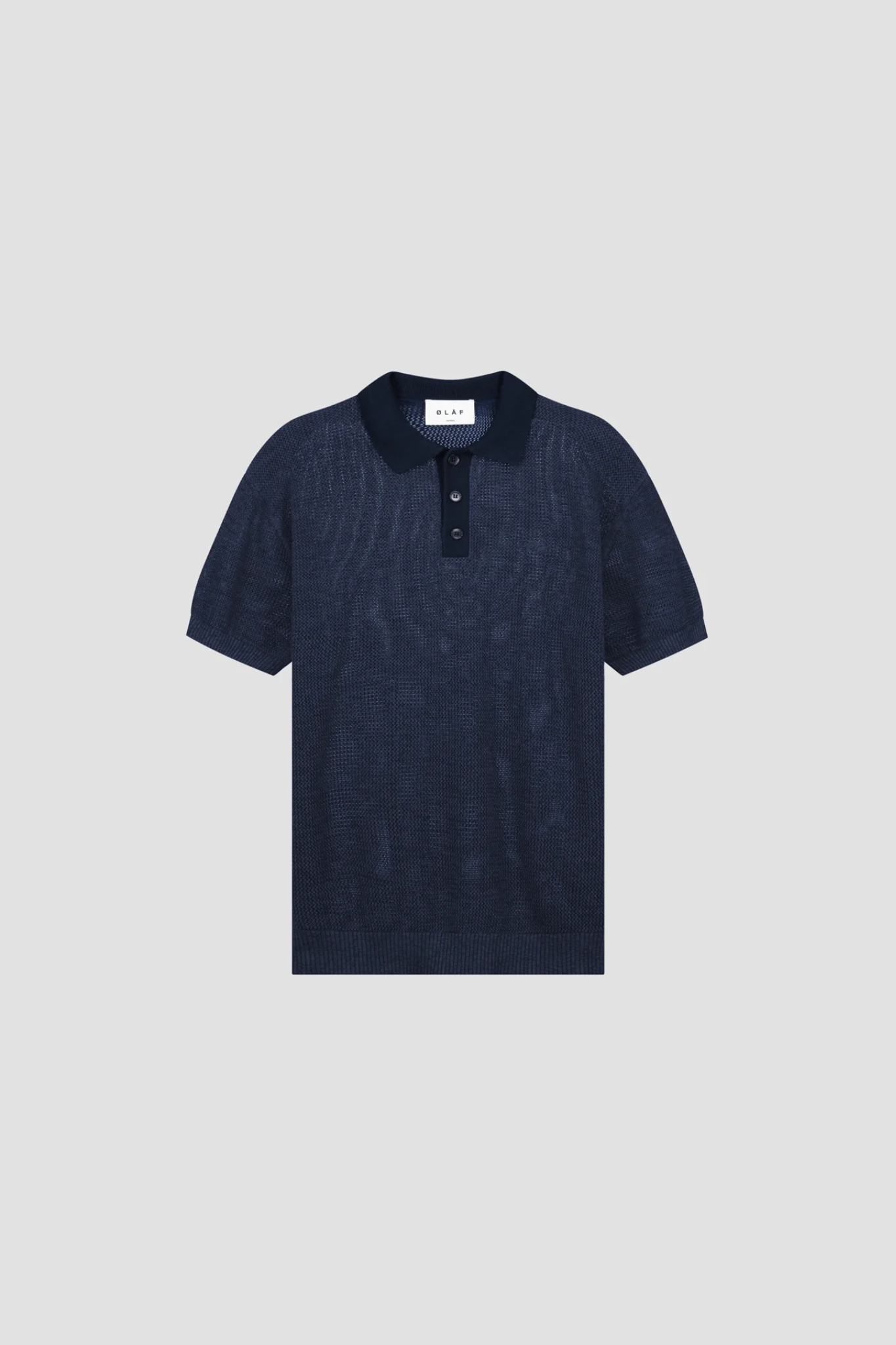 Olaf polo knit in dark navy. Front flatlay view