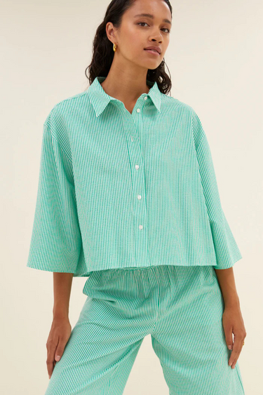 Model wearing the By-Bar bernie blouse in striped green. Front view