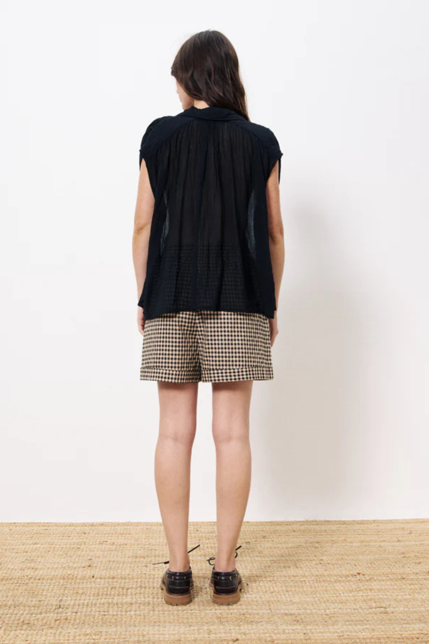 Model wearing the FRNCH pricille shirt in black. Back view