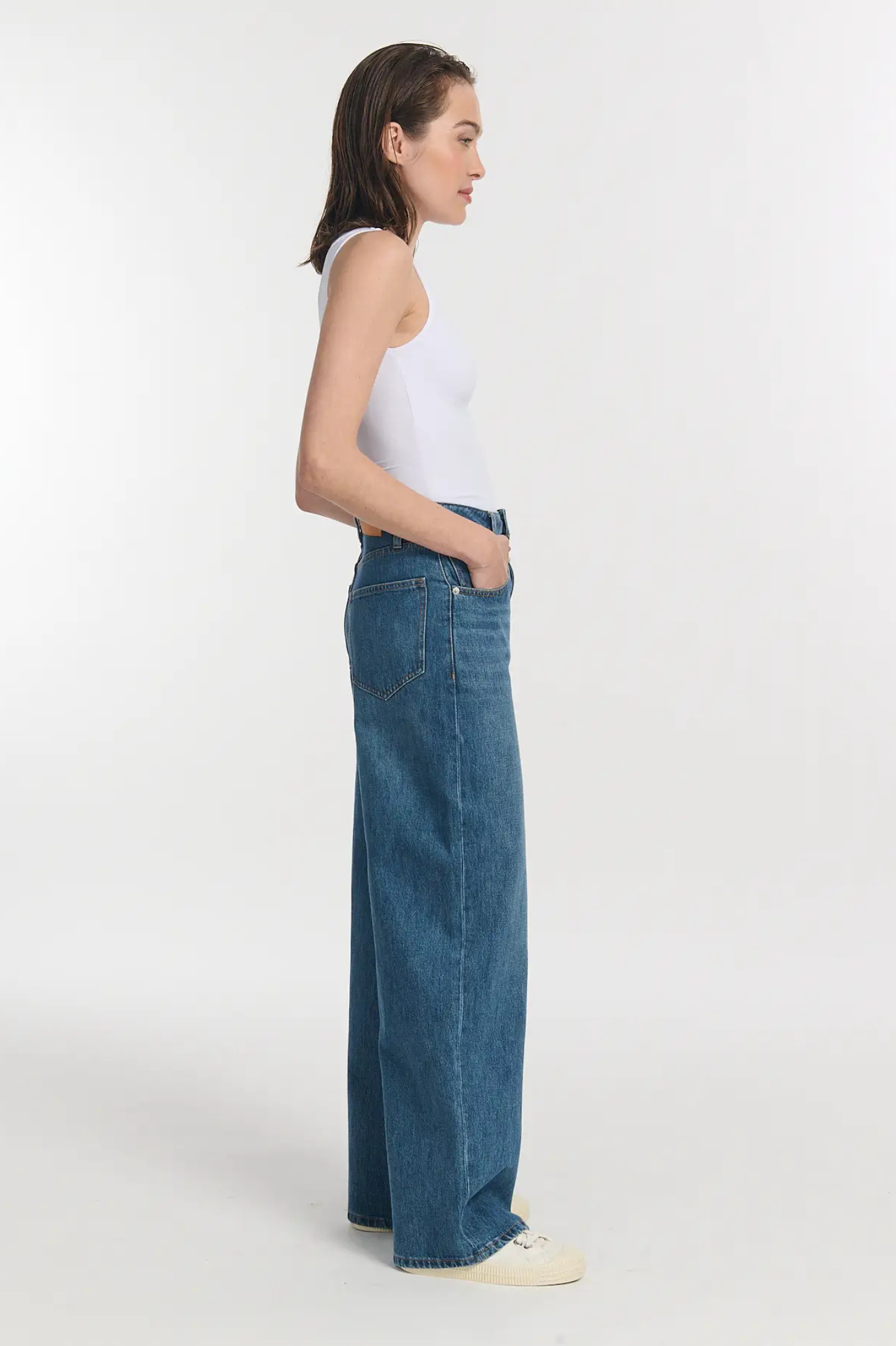 Model wearing the Labdip wilo jeans in mid blue. Side view