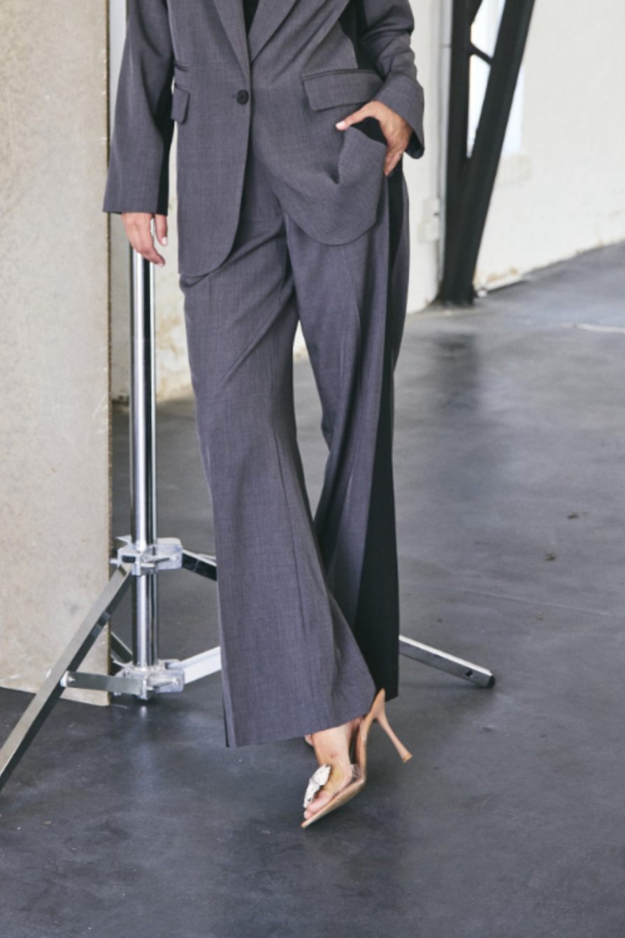 Model wearing the Co'Couture dark grey panel wide pants. Front view