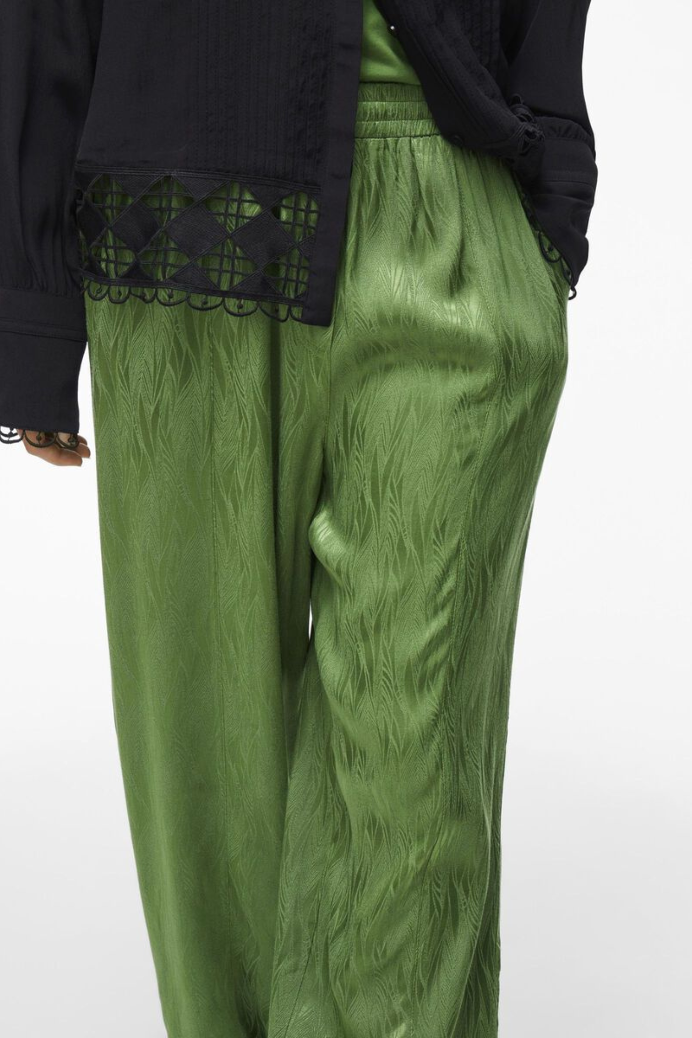 Model wearing the Rouge Edit artichoke green Roumarta trousers. Front close view