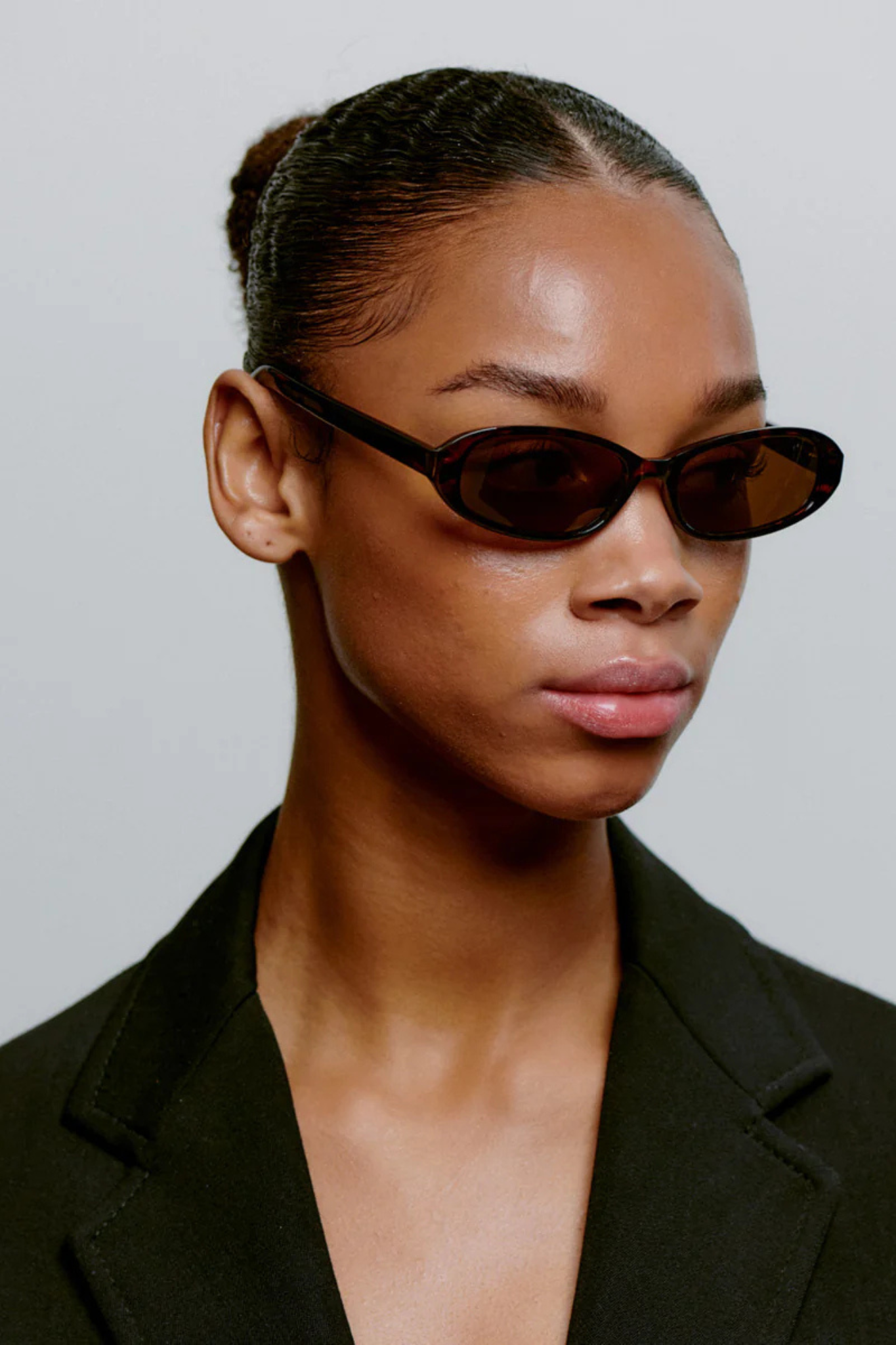 Model wearing the A. Kjaerbede macy sunglasses in demi tortoise. Side view