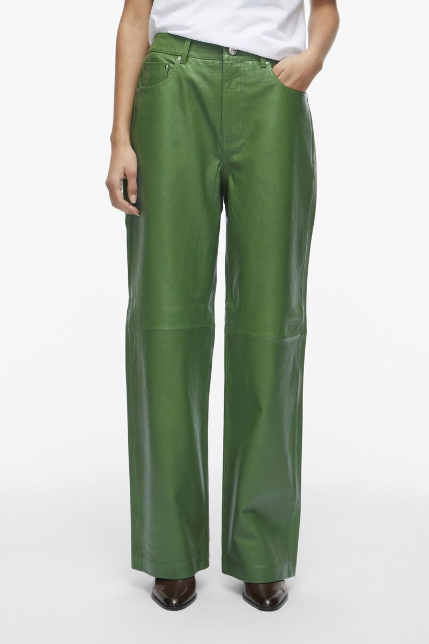 Model wearing the Rouge Edit artichoke green leather pants. Front view