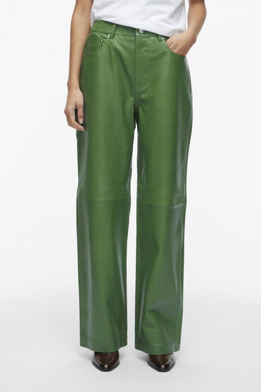 Model wearing the Rouge Edit green leather pants. Front view