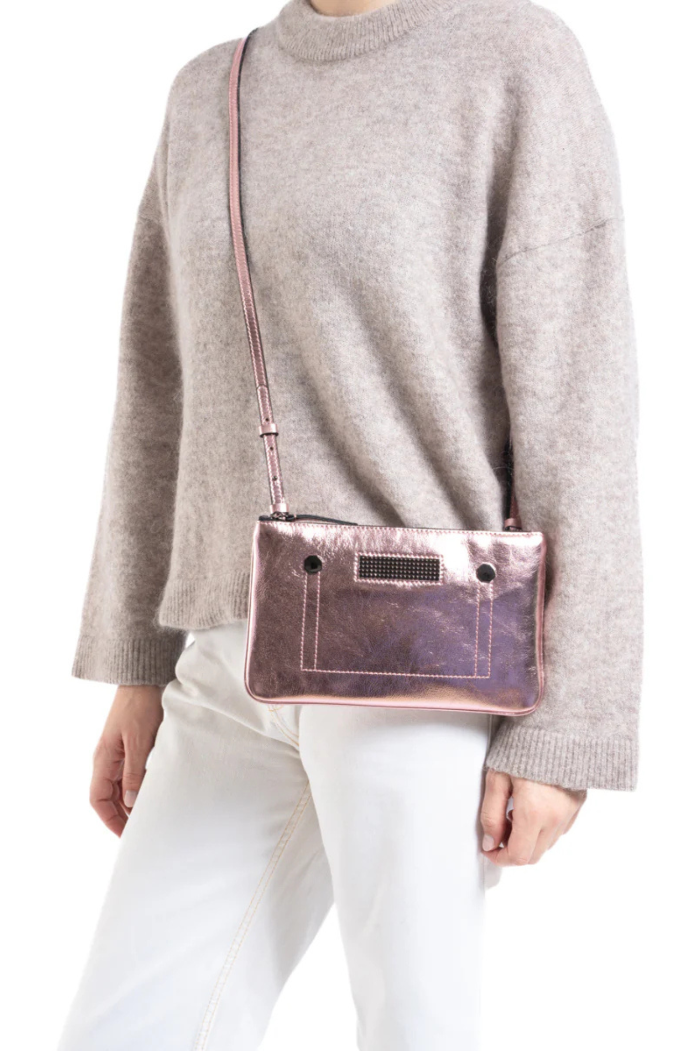 Model wearing the Clio Goldbrenner mini light pink bag. Front view