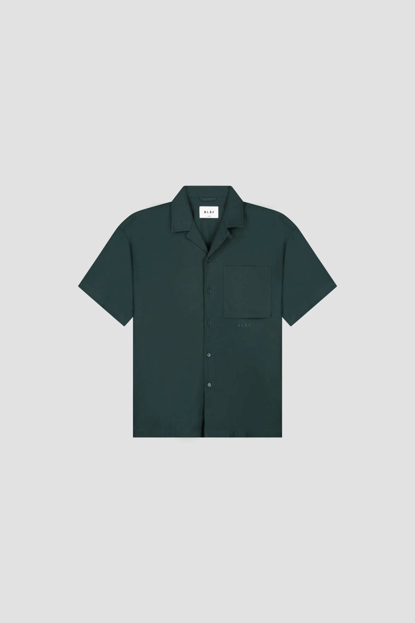 Olaf linen camp shirt in green. Front flatlay view