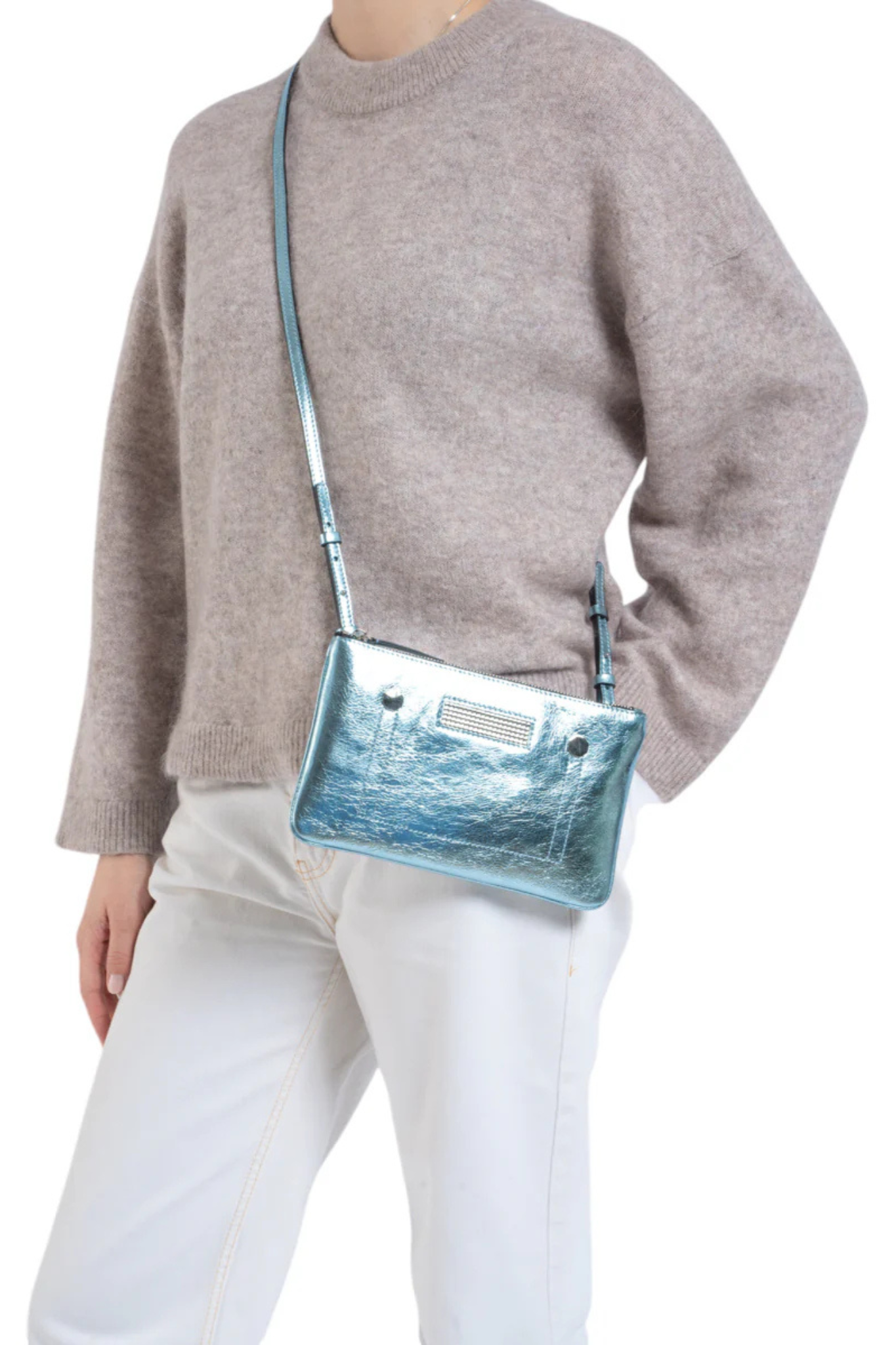 Model wearing the Clio Goldbrenner mini light blue bag. Front view