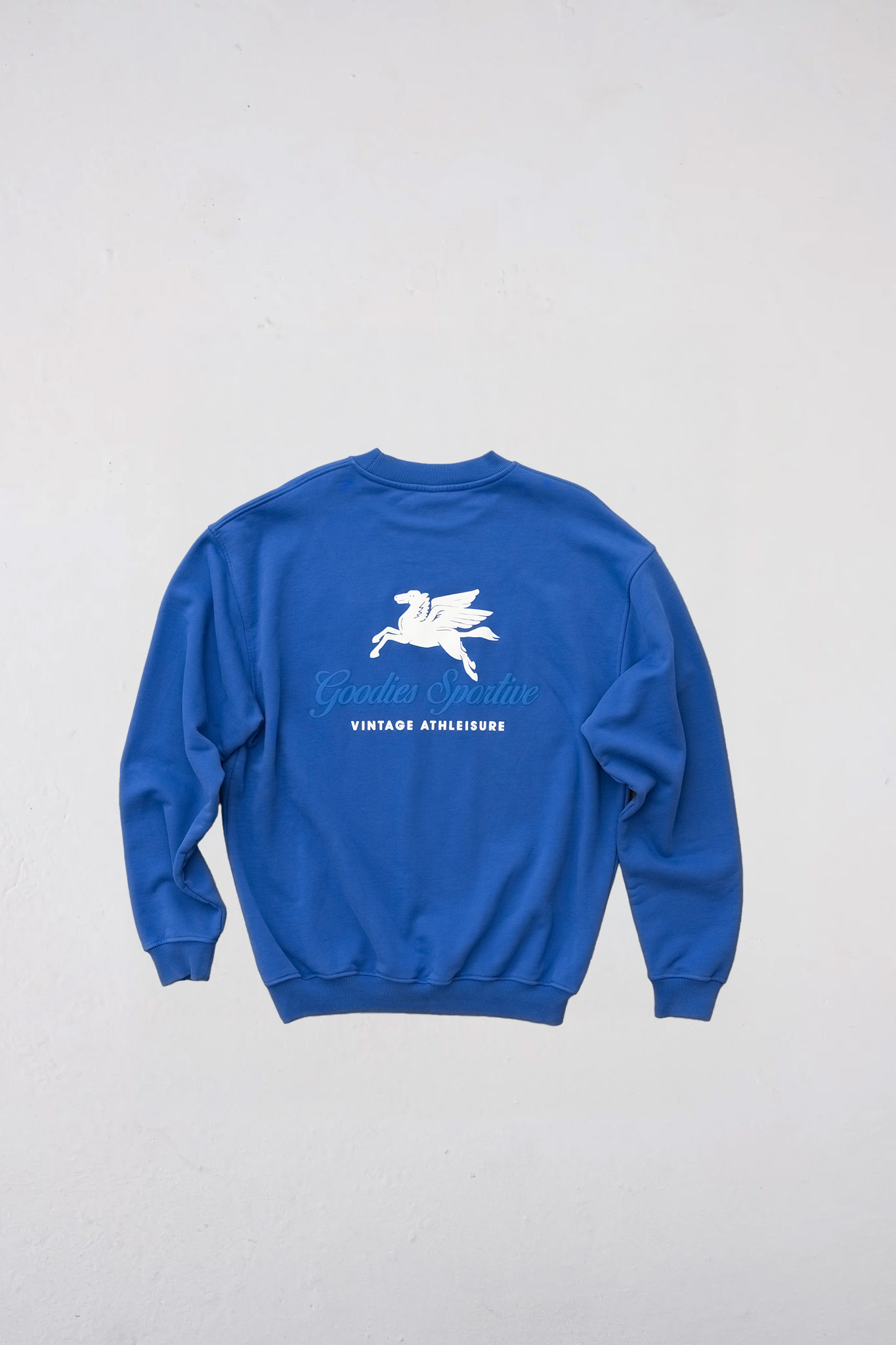 Goodies Sportive crewneck sweater in blue and logo in white. Back flatlay view