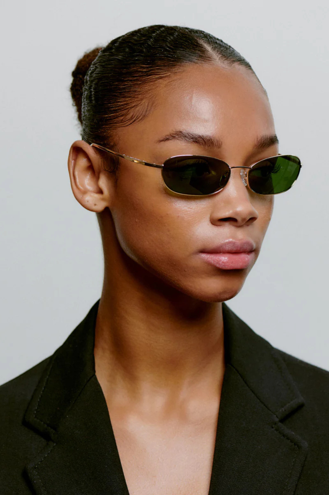 Model wearing the A. Kjaerbede jack sunglasses in gold. Side view