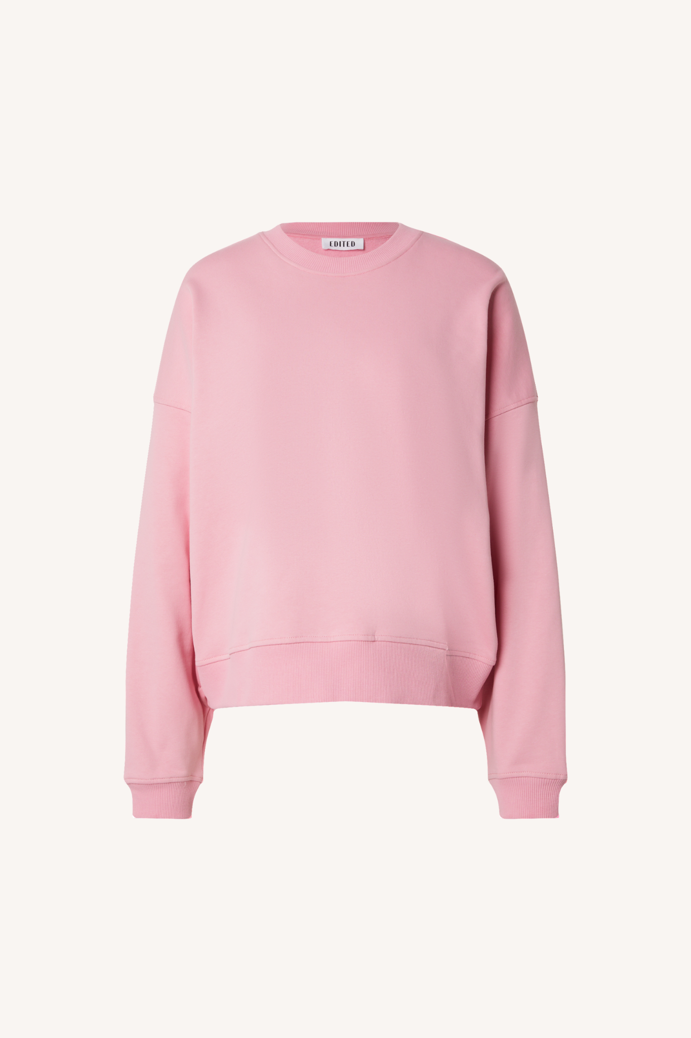 Edited Emielia sweater in pink. Front flatlay view