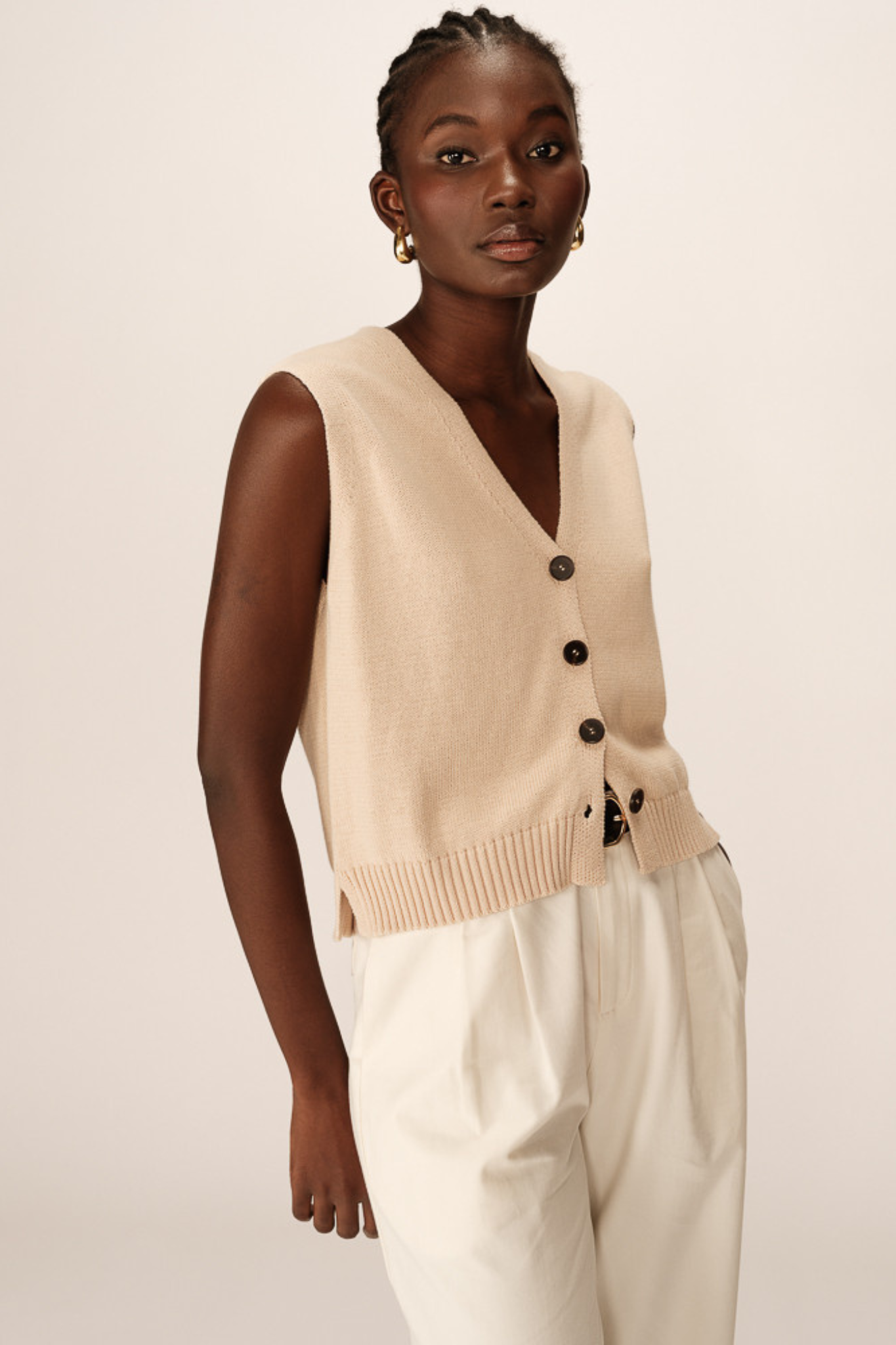 Model wearing the Grace & Mila pancake cardigan in ecru. Front view