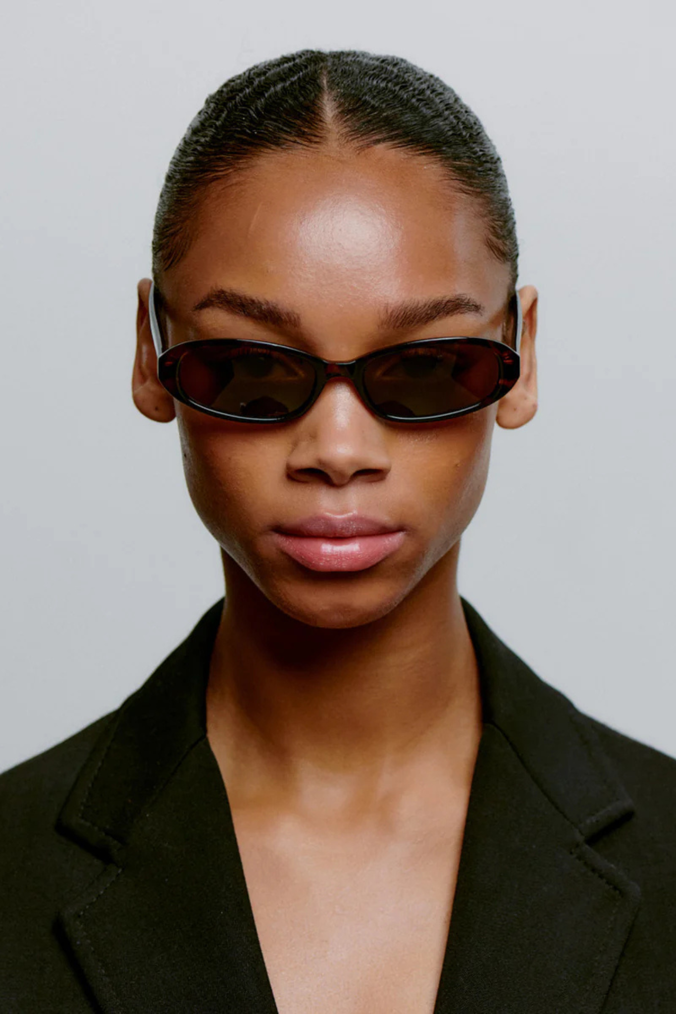 Model wearing the A. Kjaerbede macy sunglasses in demi tortoise. Front view