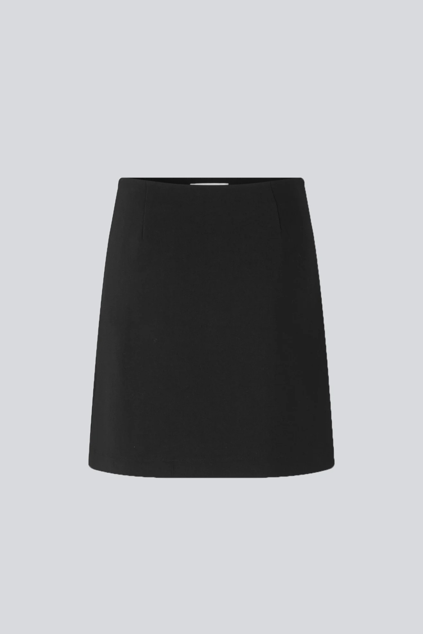 Model wearing the Modstrom gale skirt in black. Front flatlay view