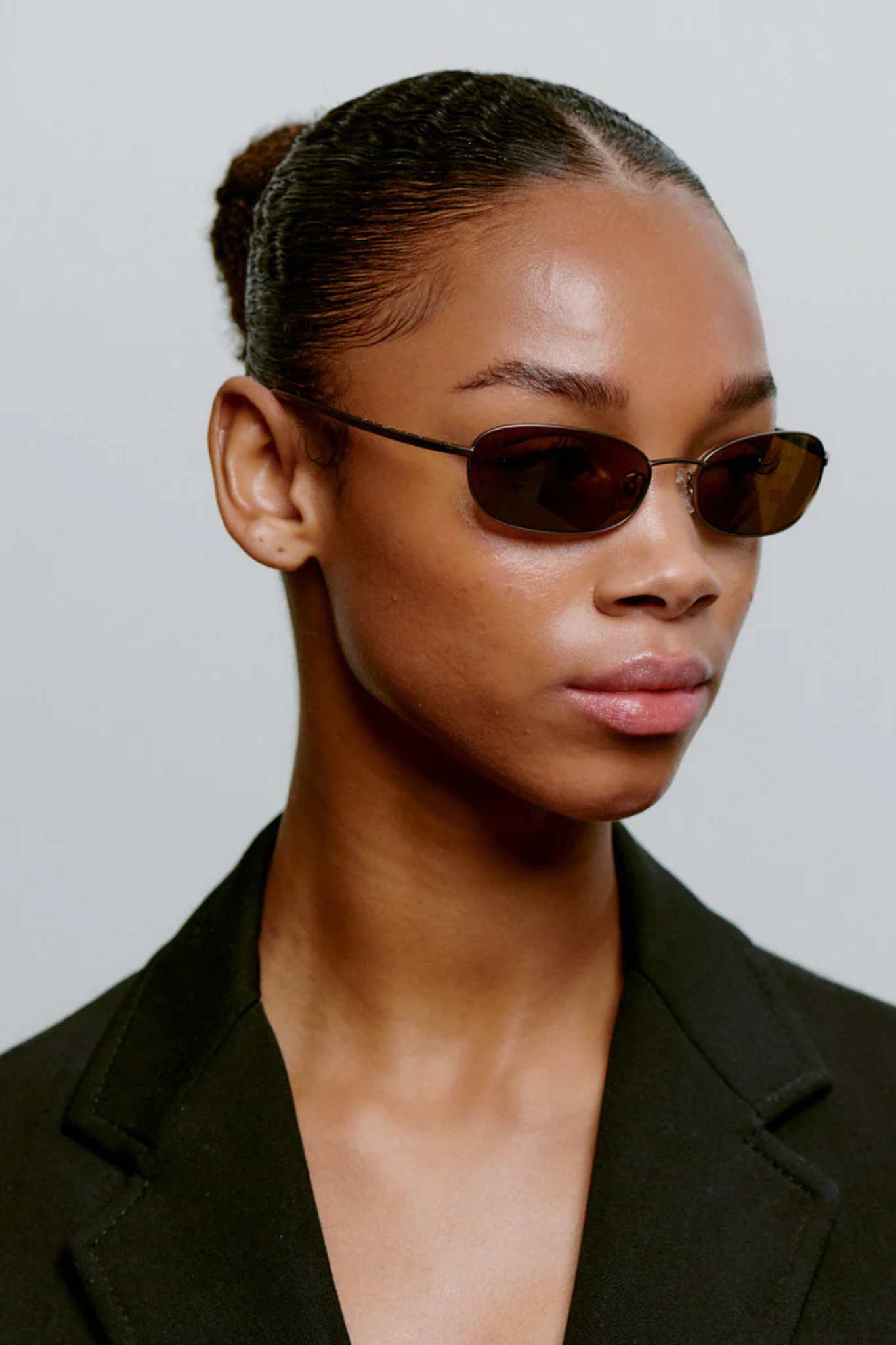 Model wearing the A. Kjaerbede jack sunglasses in matte brown. Side view