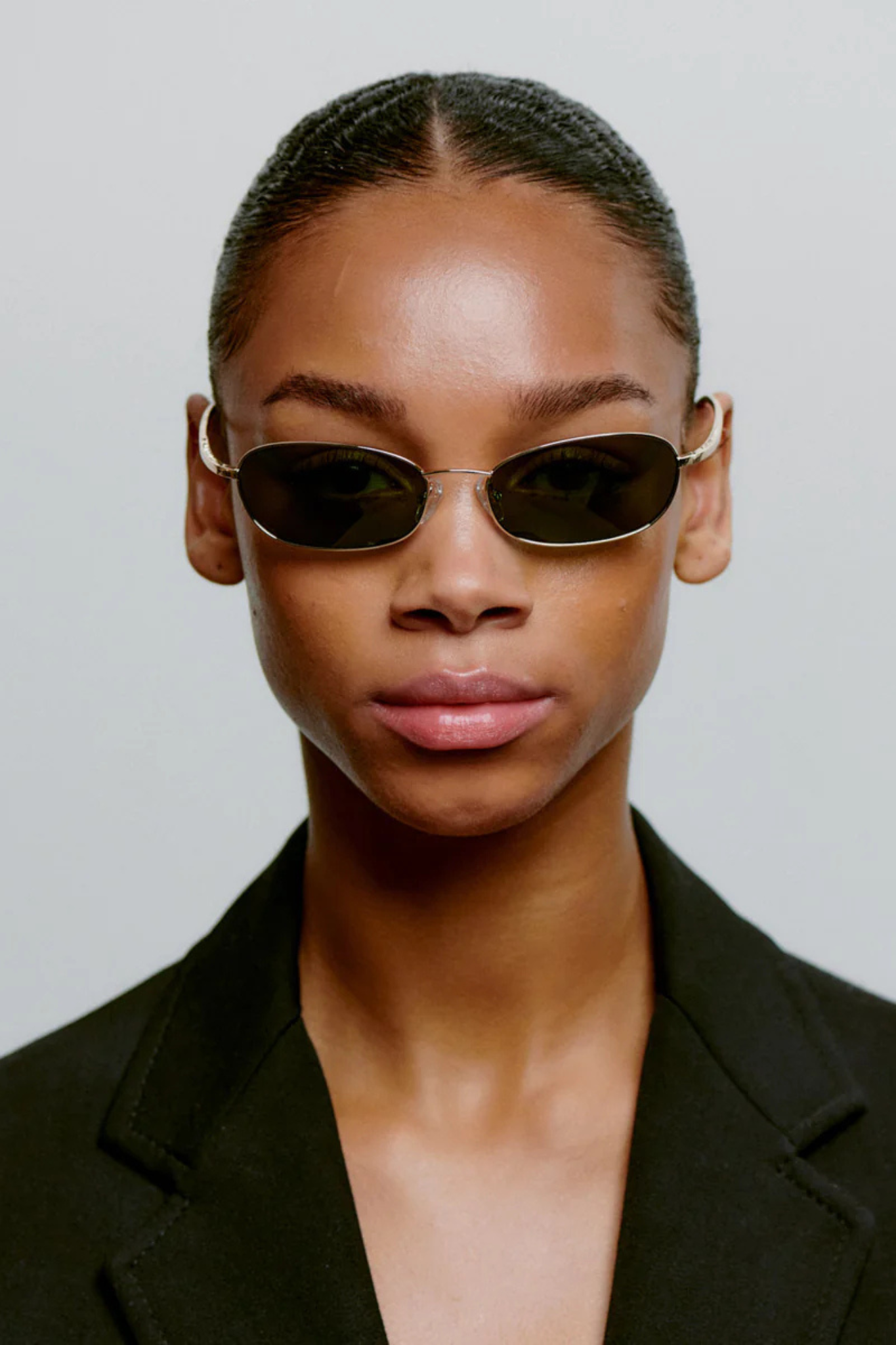 Model wearing the A. Kjaerbede jack sunglasses in gold. Front view