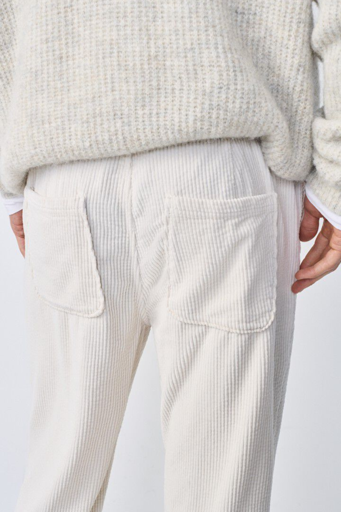 Model wearing the American Vintage padow pants in ecru vintage. Close back view