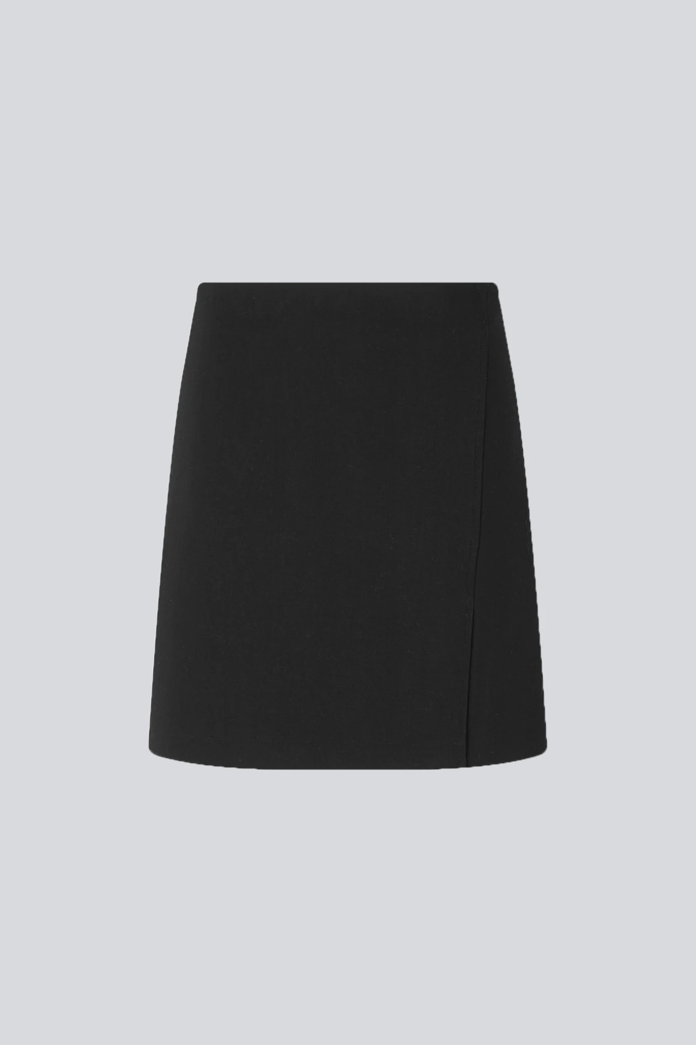 Model wearing the Modstrom gale skirt in black. Back flatlay view