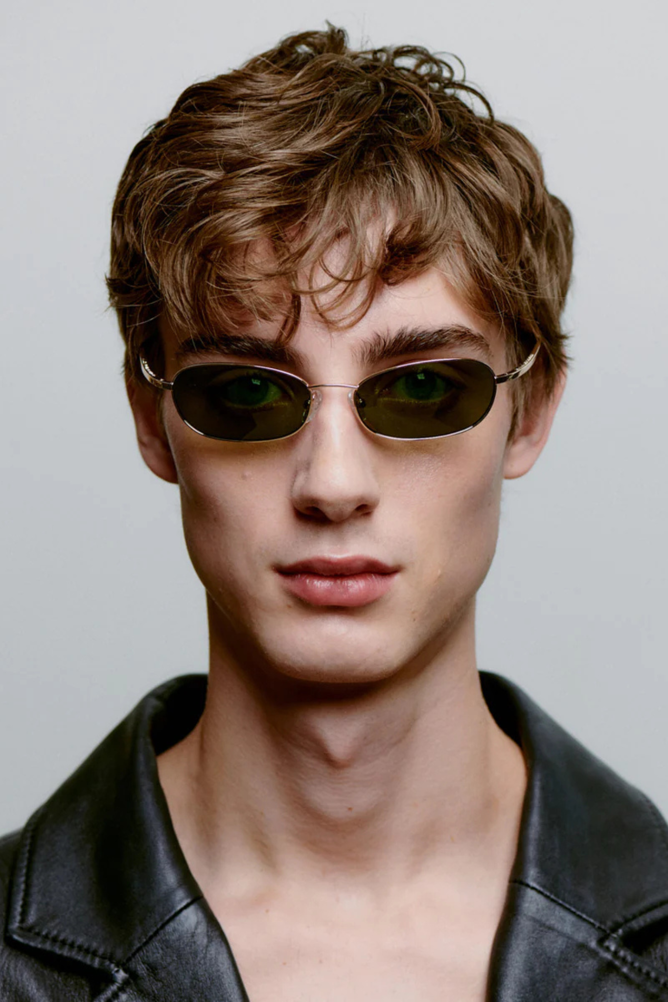 Model wearing the A. Kjaerbede jack sunglasses in gold. Front view