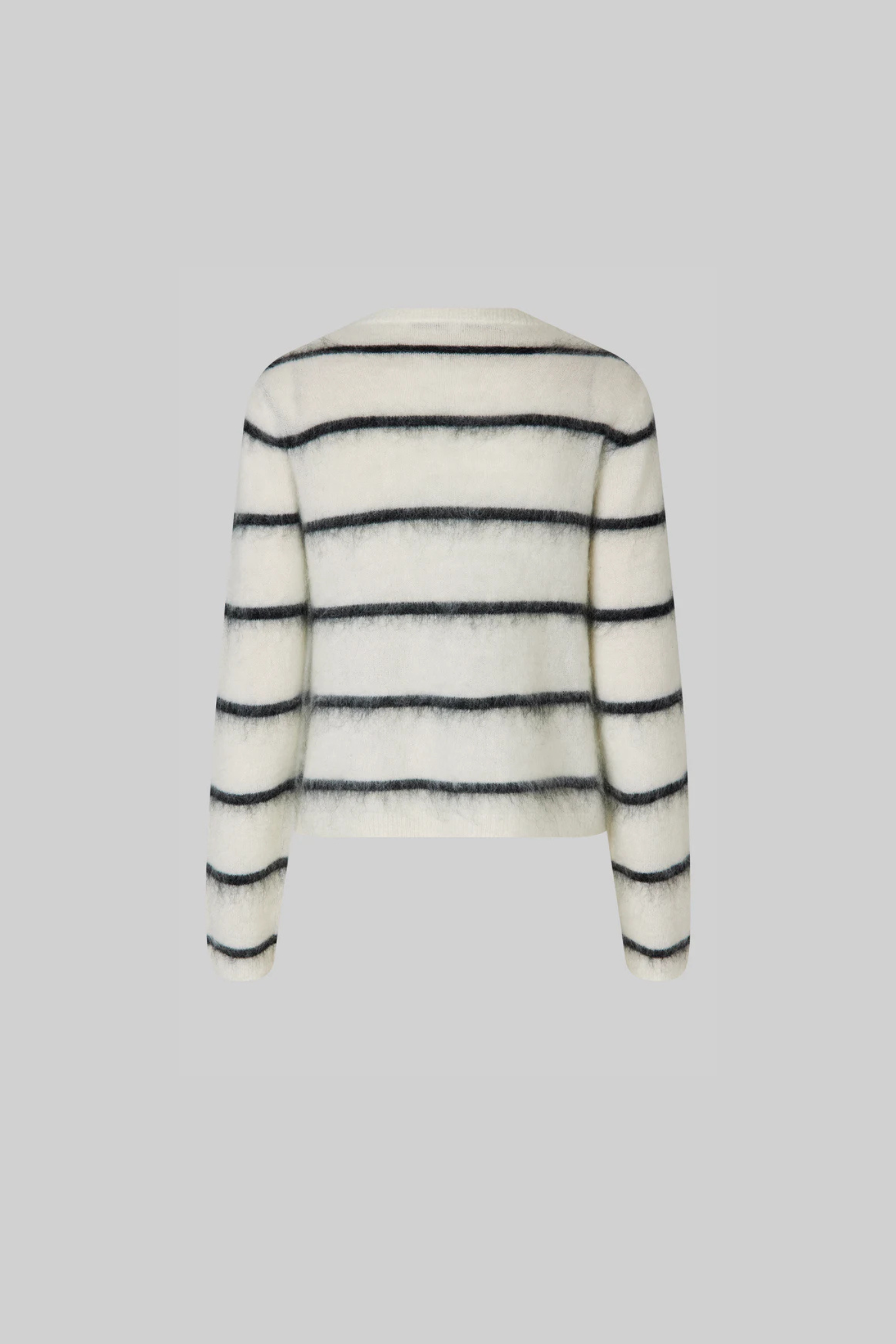 Second Female ovalina knit cardigan in striped white and black. Back view