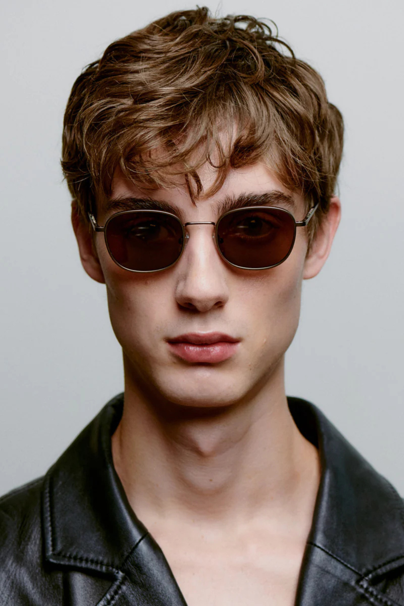 Model wearing A. Kjaerbede jack sunglasses in matte brown. Front view