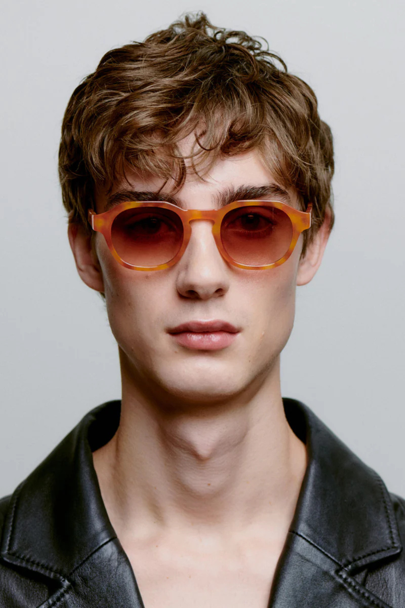 Model wearing the A. Kjaerbede zan sunglasses in burnt amber / orange. Front view