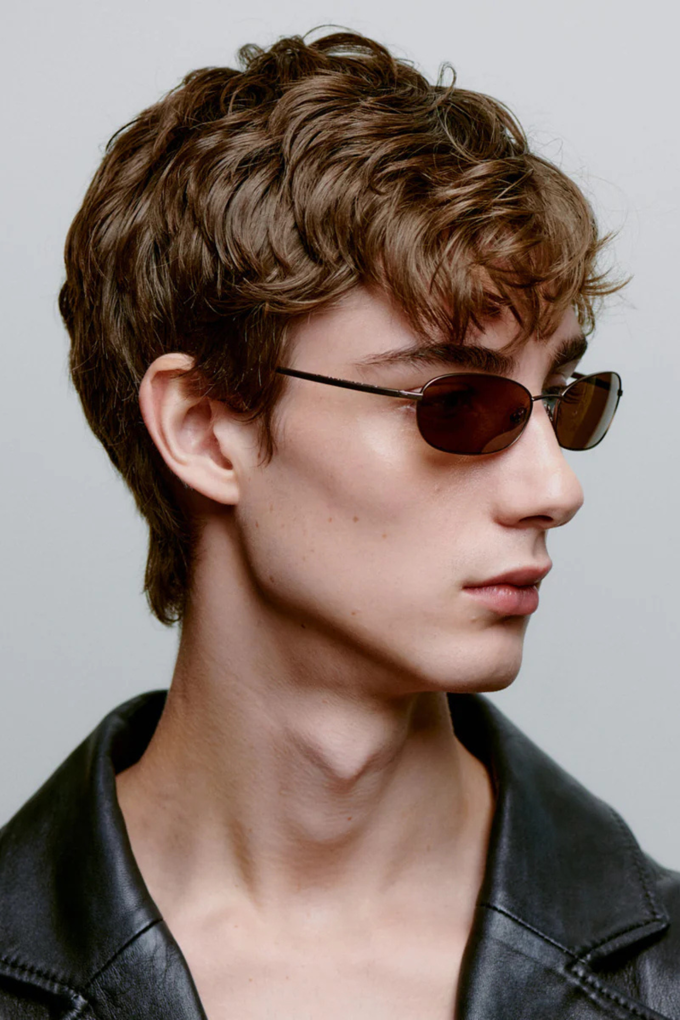 Model wearing the A. Kjaerbede jack sunglasses in matte brown. Side view