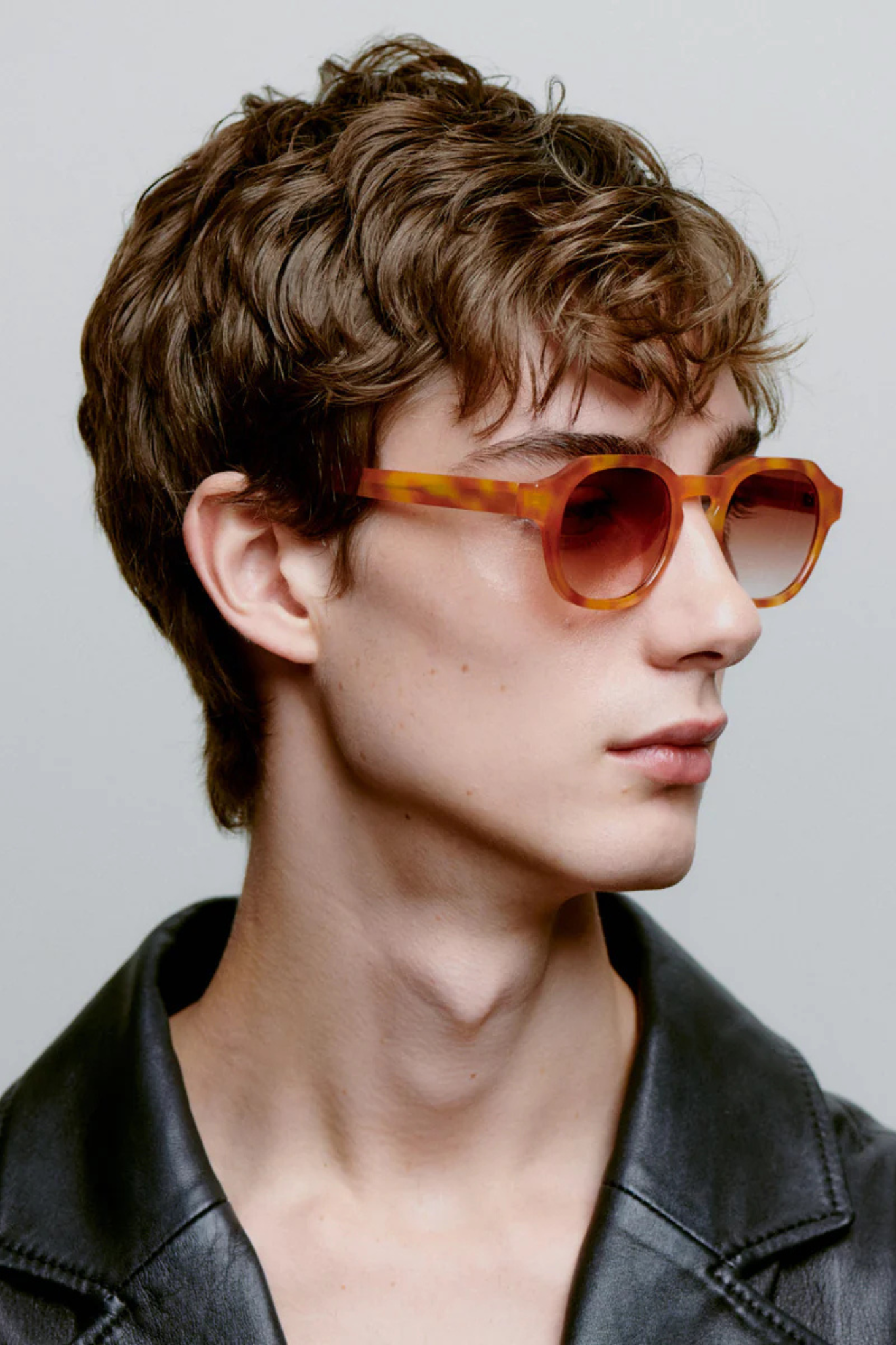 Model wearing the A. Kjaerbede zan sunglasses in burnt amber / orange. Side view