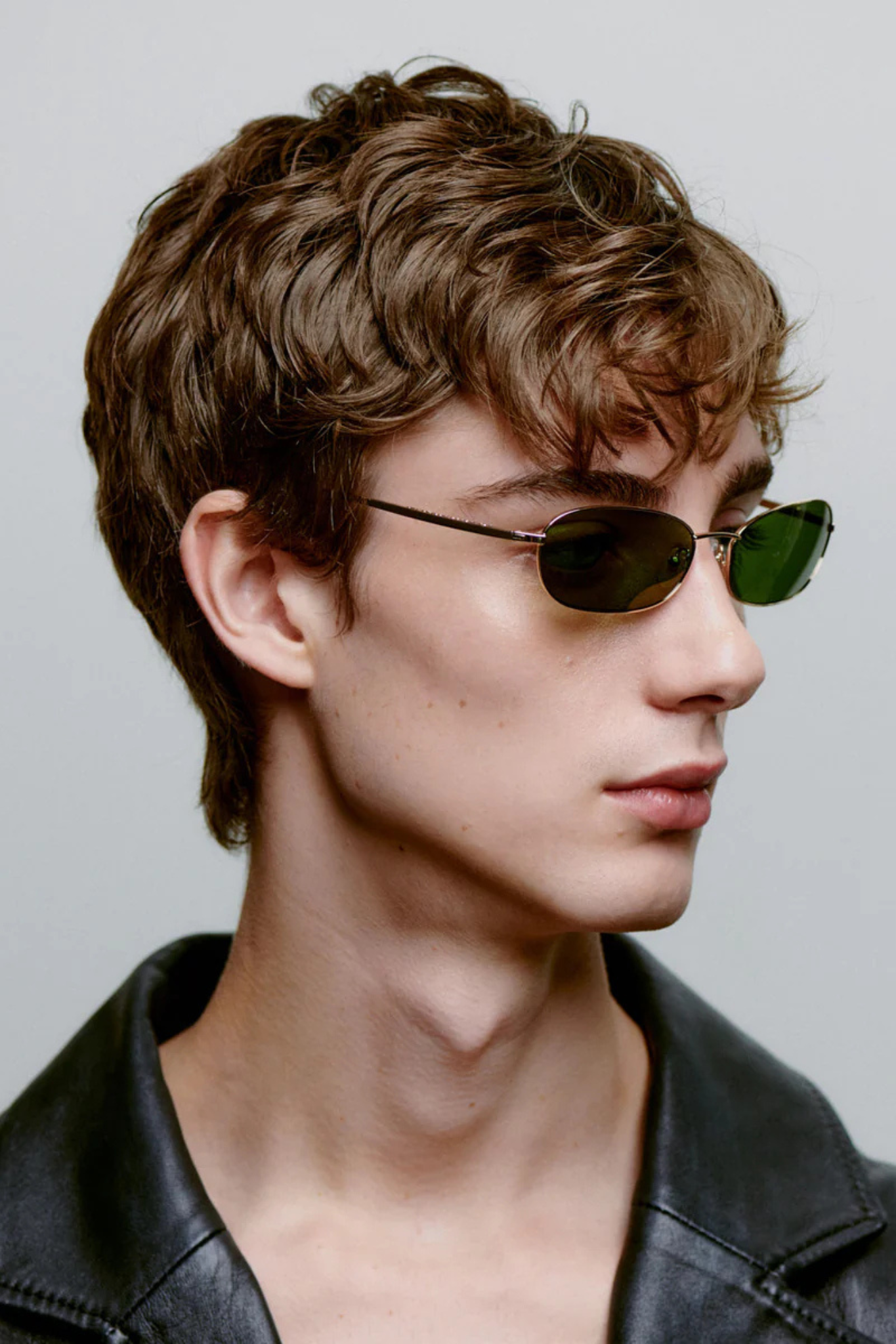 Model wearing the A. Kjaerbede jack sunglasses in gold. Side view